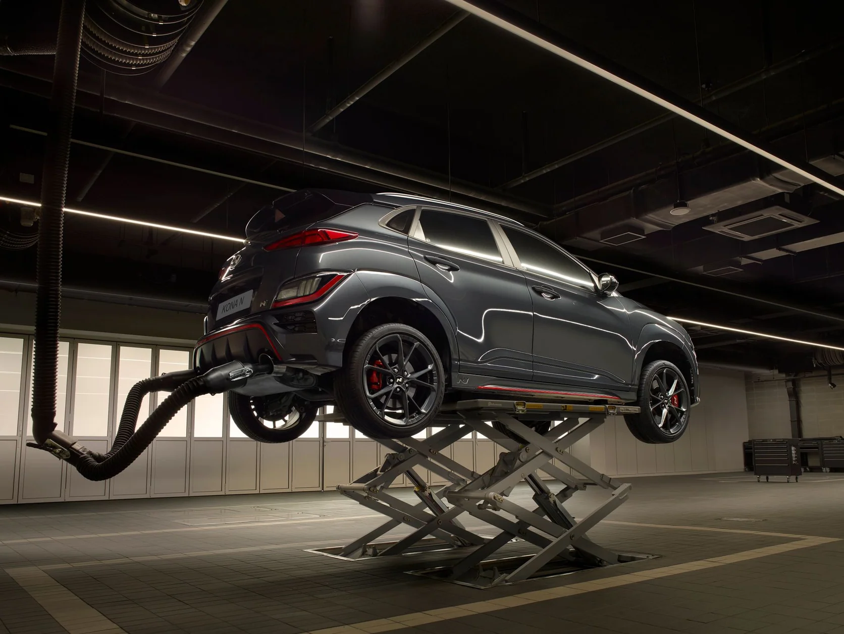 Vehicle being inspected in a modern automotive workshop
